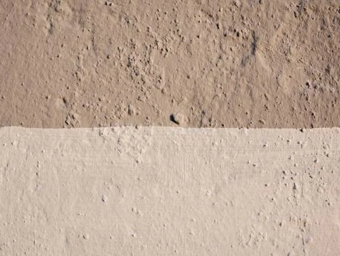 Texture of two different shades on the wall. Stock Photos