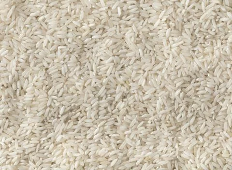 Texture of uncooked rice closeup Stock Photos