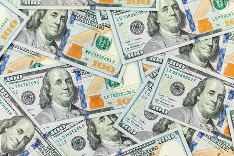 Texture with US dollars. Background of one hundred dollar bills. Stock Photos