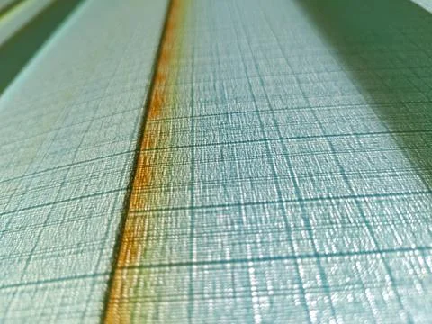 The texture of the vertical blind fabric is bluish green. Stock Photos