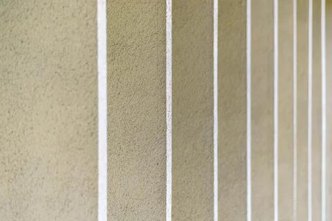 The texture is vertical flat pillars with a rough surface. Stock Photos