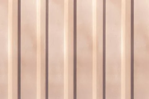 Texture of the wall with beige vertical siding panels in strips Stock Photos