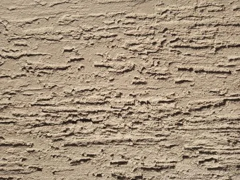 The texture of the wall with brown plaster. Stock Photos