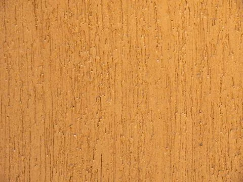 Texture. The wall is covered with light brown concrete plaster. Background. Stock Photos