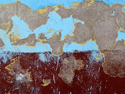 Texture of the wall with damaged plaster, painted blue and burgundy colors Stock Photos