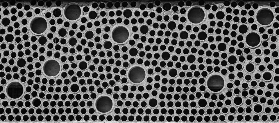 The texture of the wall is decorated with a decorative texture of cut pipes Stock Photos