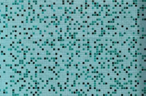 The texture of the wall, decorated with a mosaic of various small square tile Foto stock