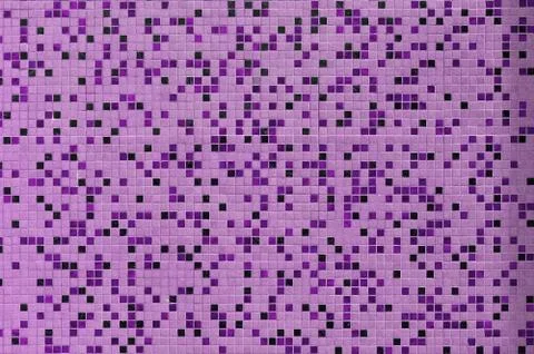 The texture of the wall, decorated with a mosaic of various small square tile Foto stock