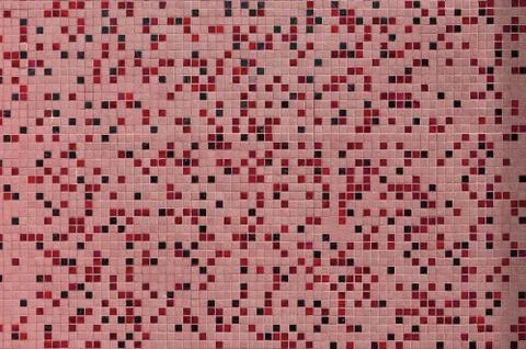 The texture of the wall, decorated with a mosaic of various small square tile 스톡 사진
