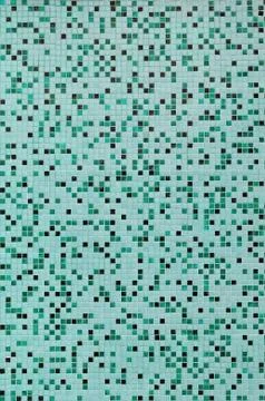 The texture of the wall, decorated with a mosaic of various small square tile 스톡 사진