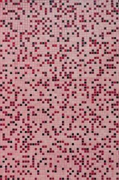 The texture of the wall, decorated with a mosaic of various small square tile Foto stock