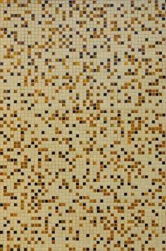 The texture of the wall, decorated with a mosaic of various small square tile Foto stock