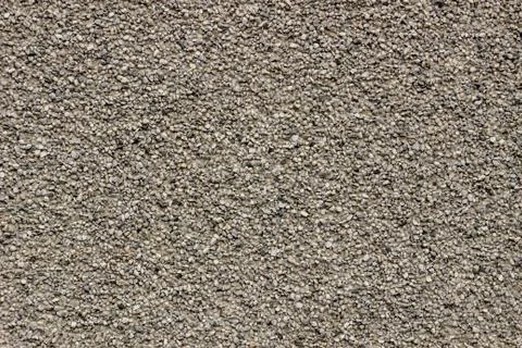 Texture of a wall with granite chips, background Stock Photos