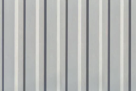 Texture of the wall with gray vertical siding panels in strips Stock Photos