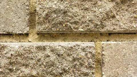 The texture of the wall of light beige brick close-up. Stock Photos