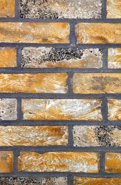 The texture of the wall is lined with straight lines of old bricks. Stock Photos