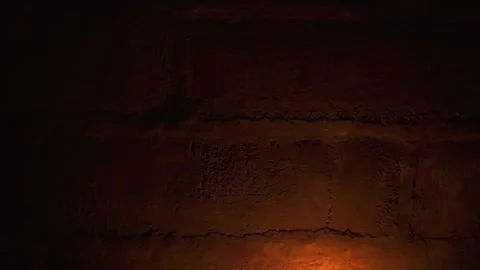 Texture of wall made with old big cement blocks illuminated by fire Stock Footage 144673828