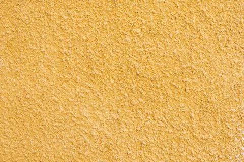Texture of the wall is made of old yellow plaster Stock Photos