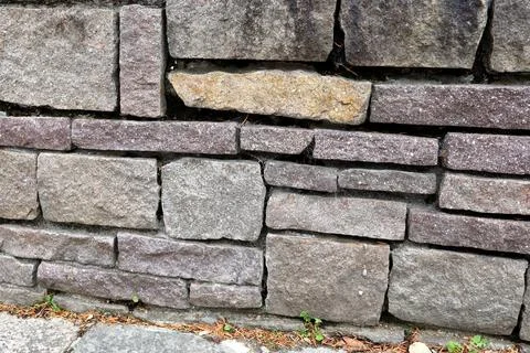 The texture of the wall made of rock. Stock Photos