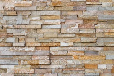 Texture of the wall made of stone tile Stock Photos