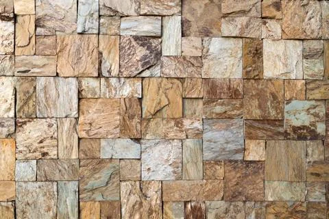 Texture of the wall made of stone tile Stock Photos