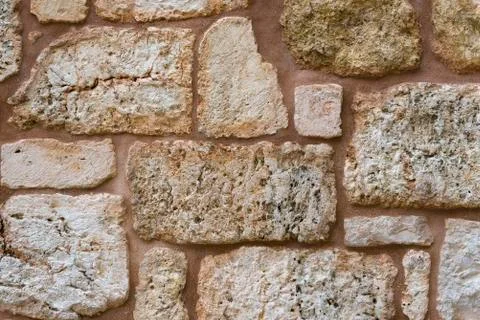 Texture of wall made of unevenly cut Jerusalem stones. Stock Photos