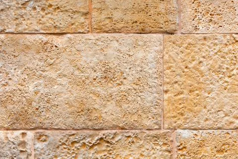 Texture of a wall from a natural stone. background. place for text. Stock Photos