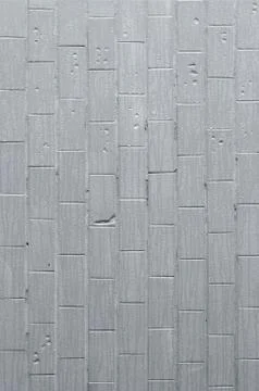 The texture of the wall from the old tile, painted gray under the influence o Stock Photos
