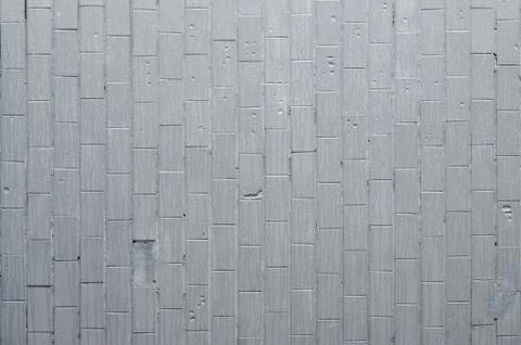 The texture of the wall from the old tile, painted gray under the influence o Stock Photos