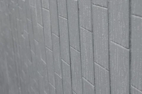 The texture of the wall from the old tile, painted gray under the influence o Stock Photos