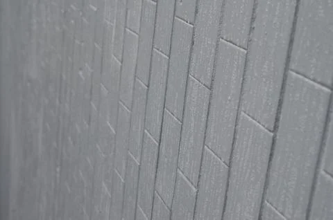 The texture of the wall from the old tile, painted gray under the influence o Stock Photos