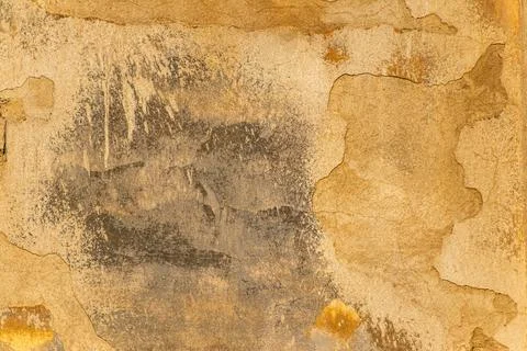 Texture of the wall with old weathered plaster of ocher color Stock Photos