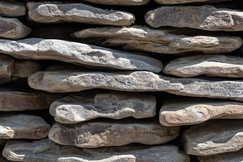 Texture of wall of pebbles Stock Photos
