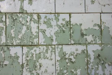 Texture of wall with peeling cracked paint - image. Stock Photos