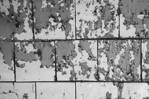 Texture of wall with peeling cracked paint - image. Stock Photos