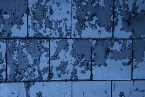 Texture of wall with peeling cracked paint - image. Stock Photos