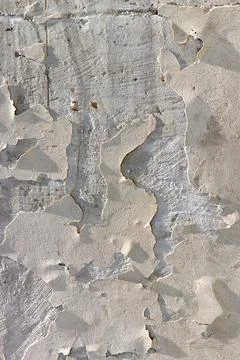 Texture of the wall with peeling plaster Stock Photos