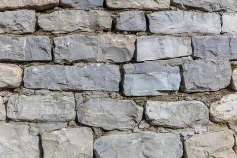 The texture of the wall from the river cobblestones Stock Photos