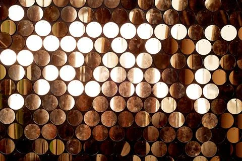 Texture, wall with round gold sequins. The atmosphere of glamour. Stock Photos