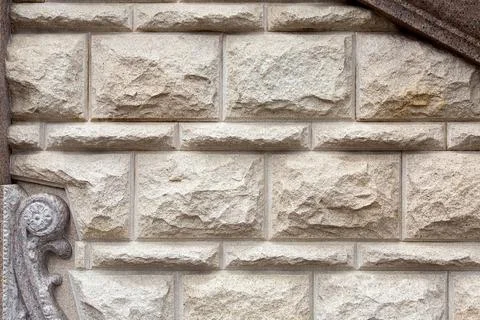 Texture of a wall from a stone rustication of a building in retro style. Stock Photos