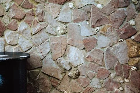 Texture of the wall of stones of different sizes, shell rocks Stock Photos