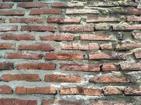 The texture of the walls where the bricks are still visible. Stock Photos