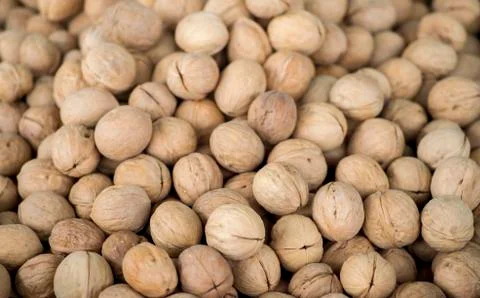 The texture of walnuts on the counter of the store. Background Stock Photos