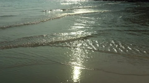 Texture Of Water And Sand. Bright Golden Sand. Waves Break On The Sandy Shore Video stock 112590174