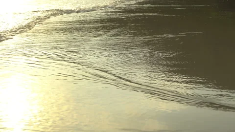 Texture Of Water And Sand. Bright Golden Sand. Waves Break On The Sandy Shore Video stock 112590450