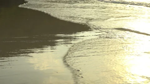 Texture Of Water And Sand. Bright Golden Sand. Waves Break On The Sandy Shore Video stock 112590637