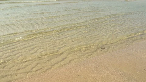 Texture Of Water And Sand. Bright Golden Sand. Waves Break On The Sandy Shore Video stock 112590640