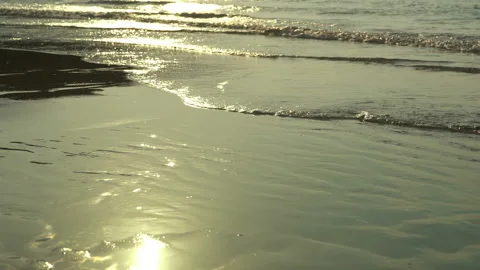 Texture Of Water And Sand. Bright Golden Sand. Waves Break On The Sandy Shore Stock Footage 112590722