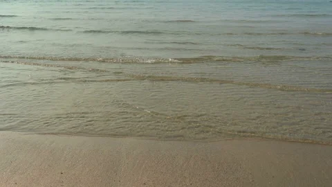 Texture Of Water And Sand. Bright Golden Sand. Waves Break On The Sandy Shore Video stock 112590939