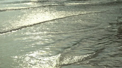 Texture Of Water And Sand. Bright Golden Sand. Waves Break On The Sandy Shore Stock Footage 112591904